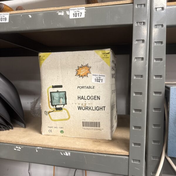 Used portable halogen work light for job site illumination.