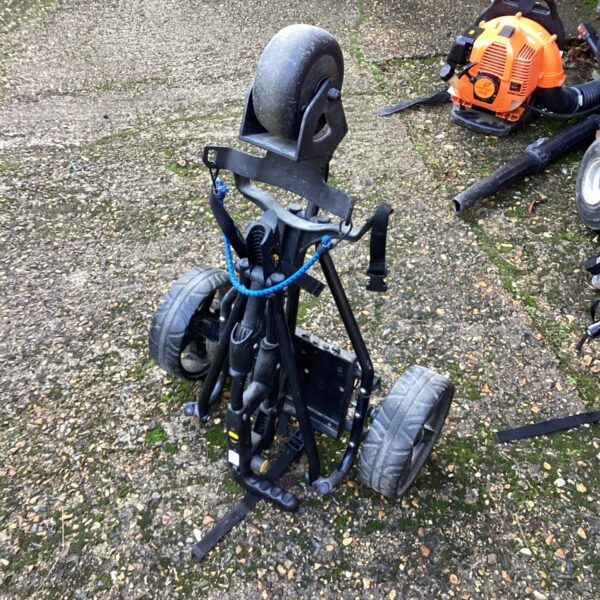 Used Powakaddy golf trolley with folding design.