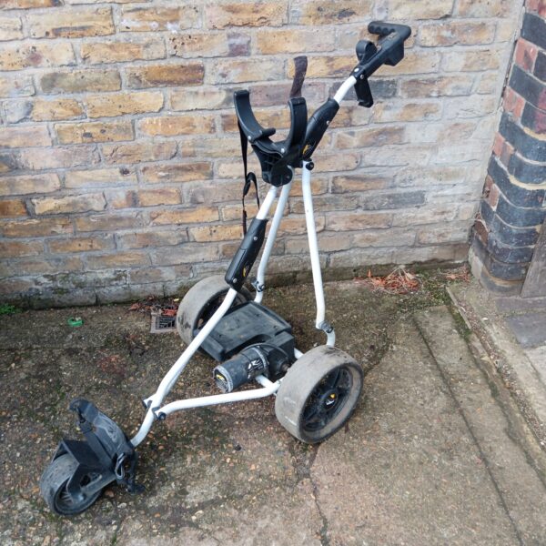 Used Powakaddy golf trolley with folding frame and wheels.