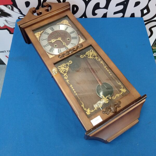 Vintage President 31 day wall clock with Roman numerals.