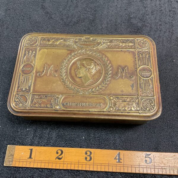 Front view of Princess Mary 1914 brass gift tin.