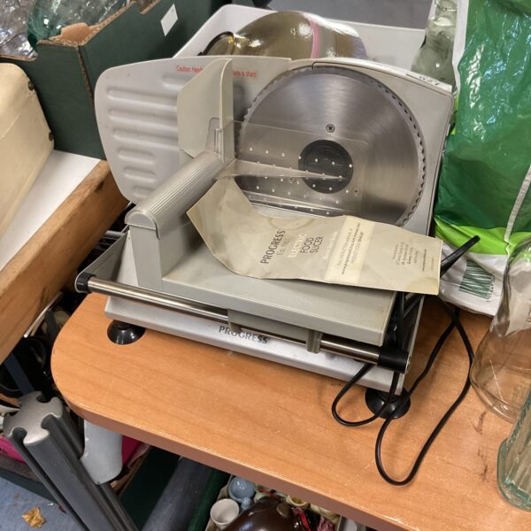 Vintage Progress electric food slicer for kitchen use.