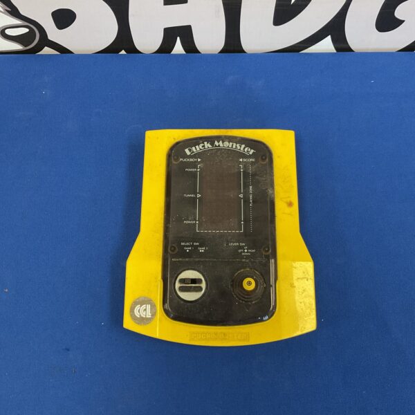 Front view of vintage Puck Monster handheld game.