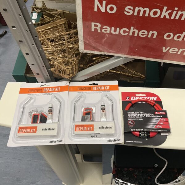 Vintage milestone puncture repair kits and Dekton chain lock.