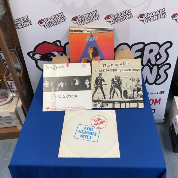 Punk LP collection featuring Sex Pistols and The Damned vinyl records.