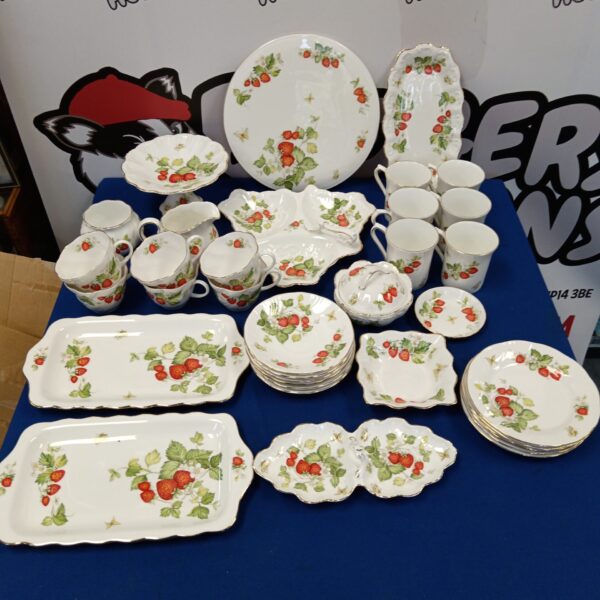 Large vintage Queens Rosina Virginia strawberry china set on display.