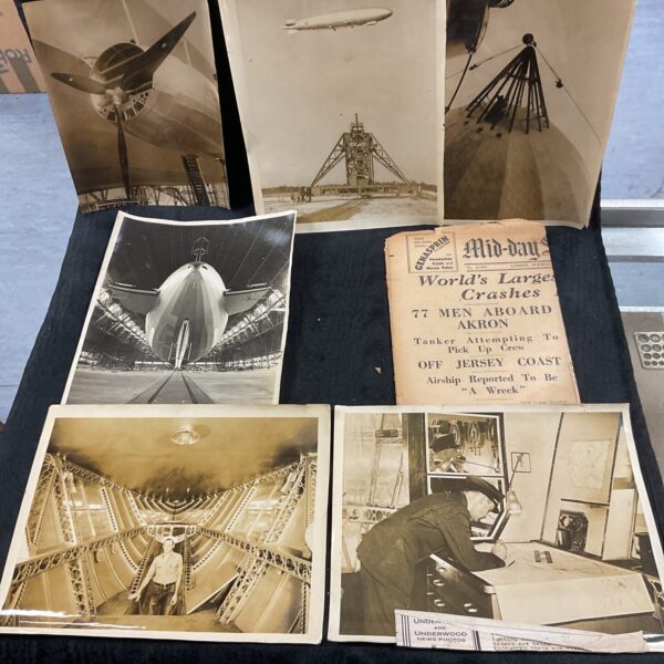 Vintage photographs of the R100 airship and newspaper clippings detailing its crash.