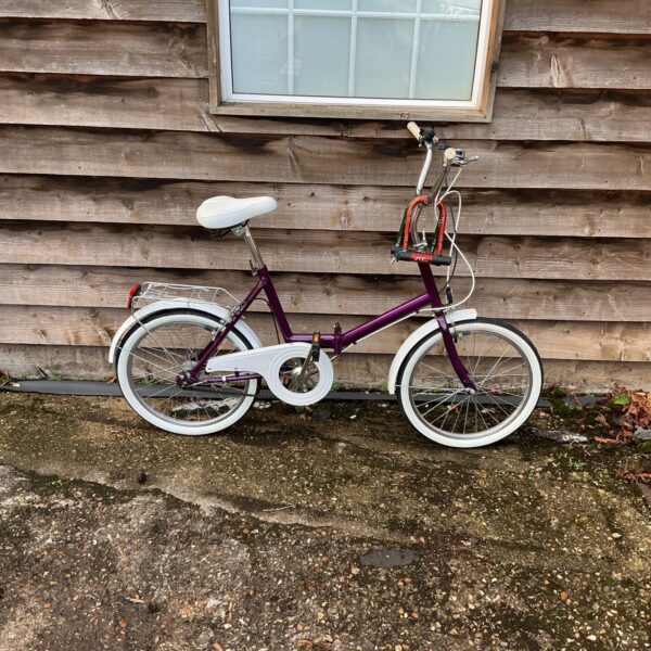 Vintage purple Raleigh folding bike in good condition.
