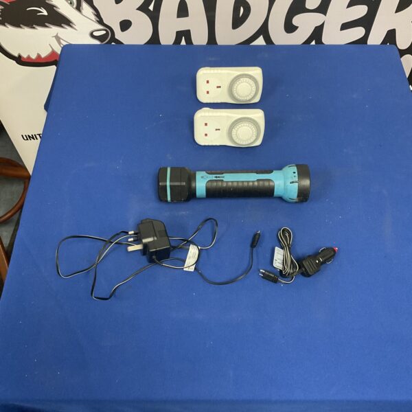 Rechargeable torch set with electric timers on a table.