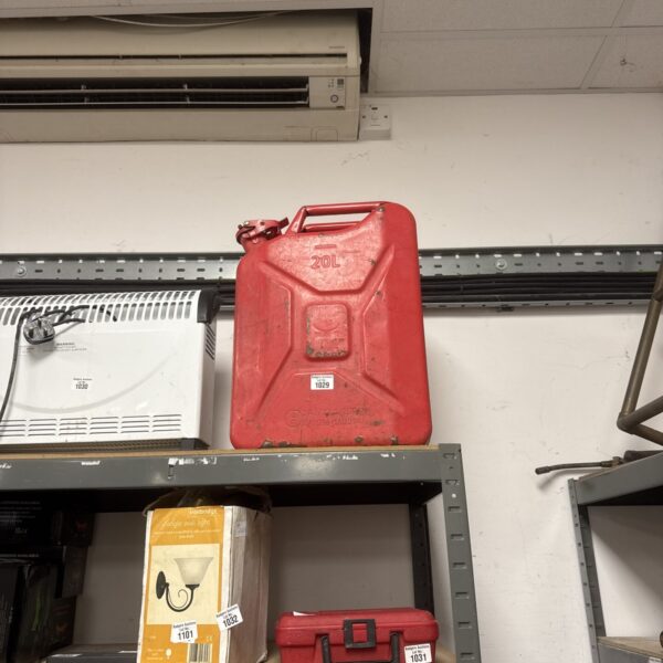 Red 20L Jerry Can, a vintage metal fuel container.