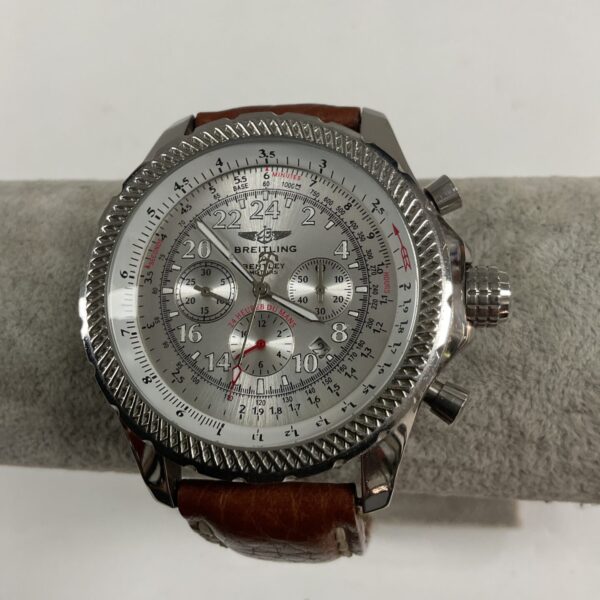 Front view of a stainless steel reproduction automatic wristwatch.