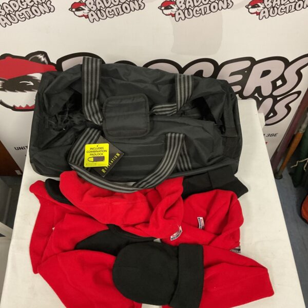 Vintage Revelation suitcase with red and black beanies.