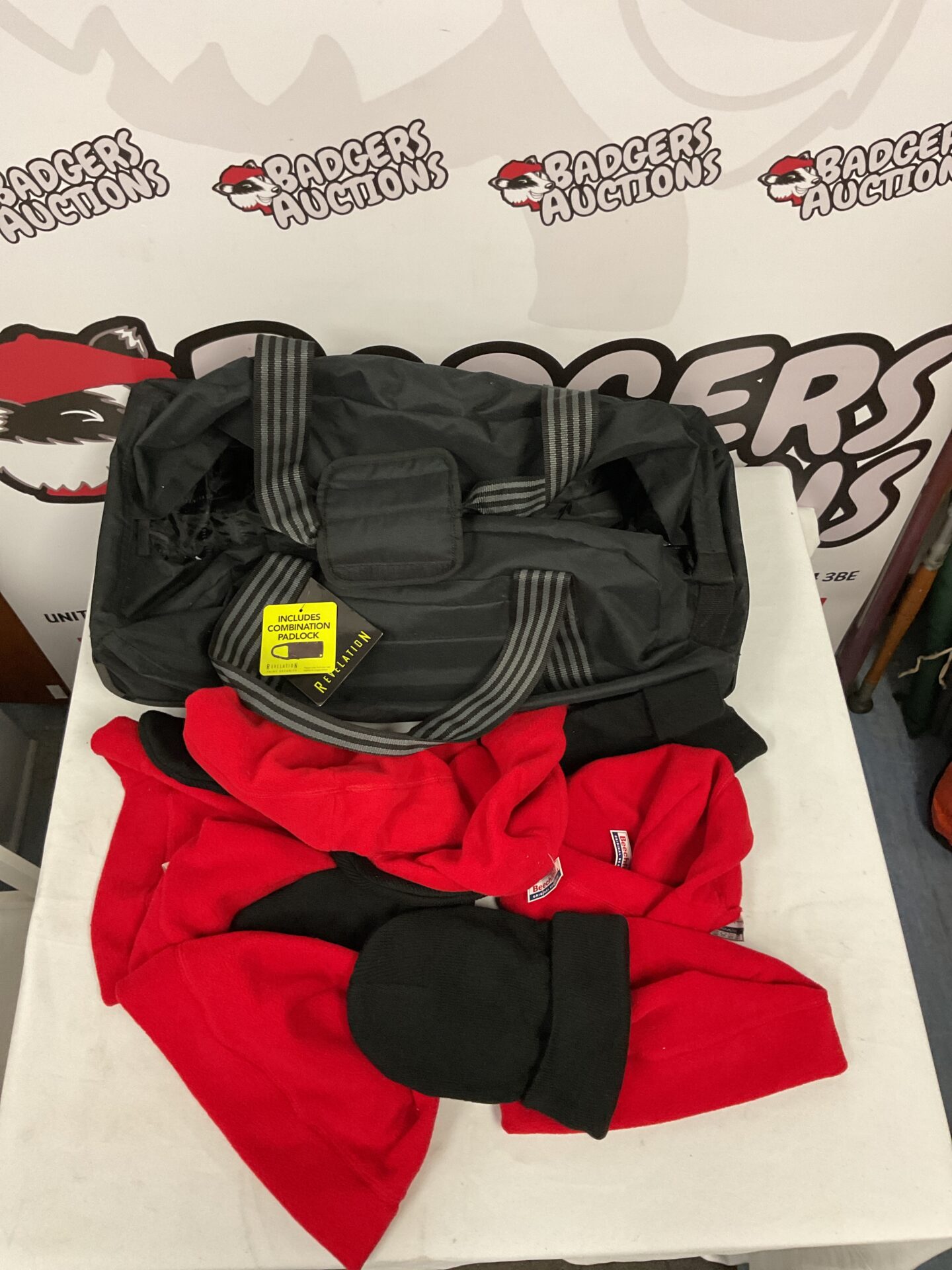 Vintage Revelation suitcase with red and black beanies.