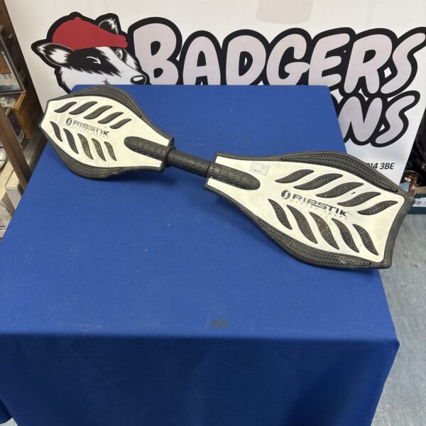 Close-up of a used Ripstick caster board deck.