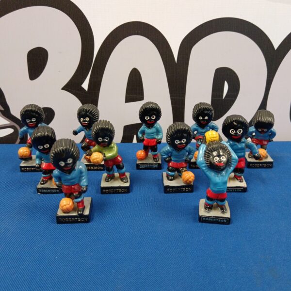 Vintage Robertson's Golly football team collectible figures on display.