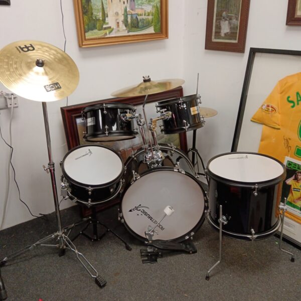 Vintage Rocket child's drum kit with cymbals and stands.