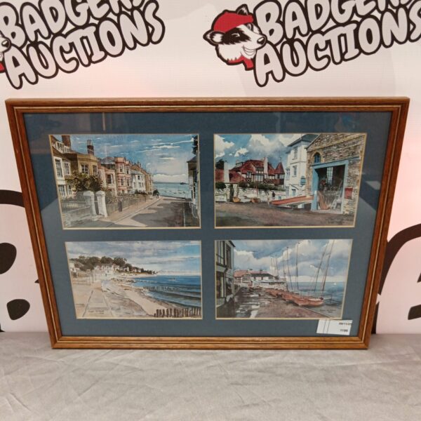 Framed Roger Hickman seaside print depicting a coastal town.