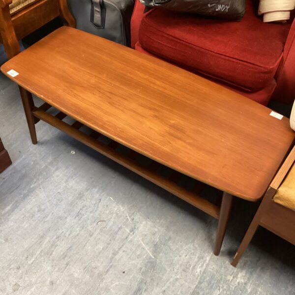 Vintage Romanian teak coffee table with warm wood grain.