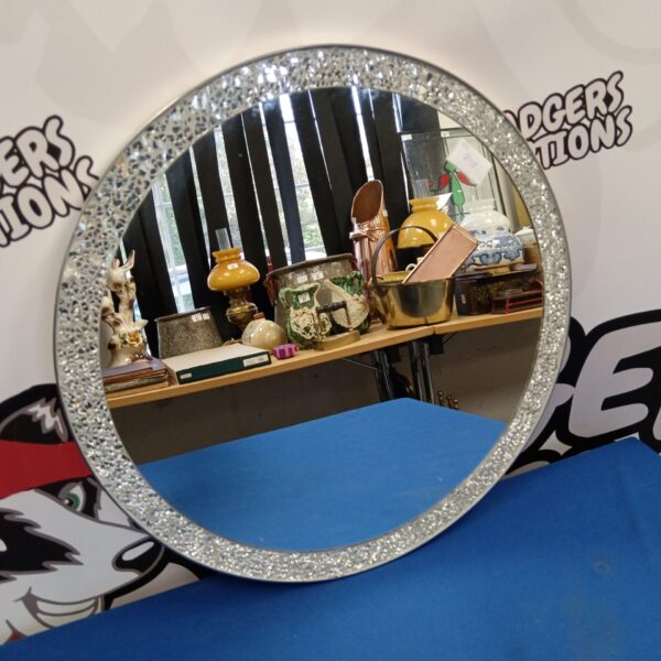 Vintage round mosaic mirror for home decor.