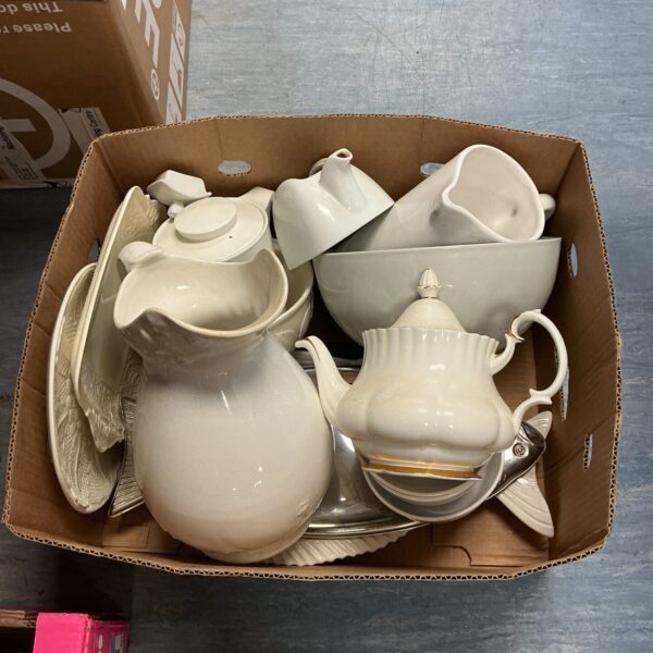 White Royal Albert china collection in a cardboard box.