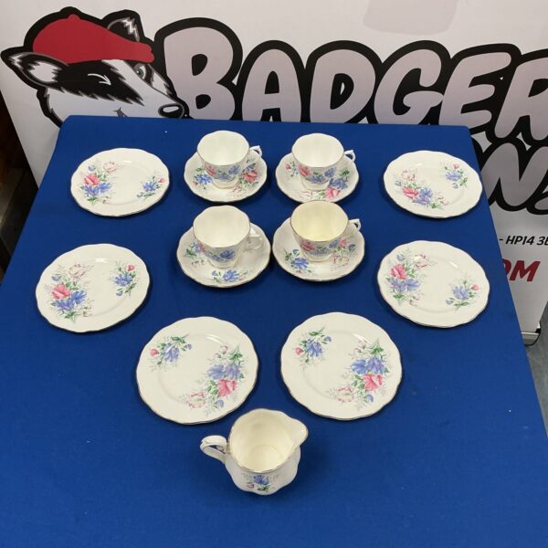 Royal Albert Friendship tea cup and saucer with floral design.