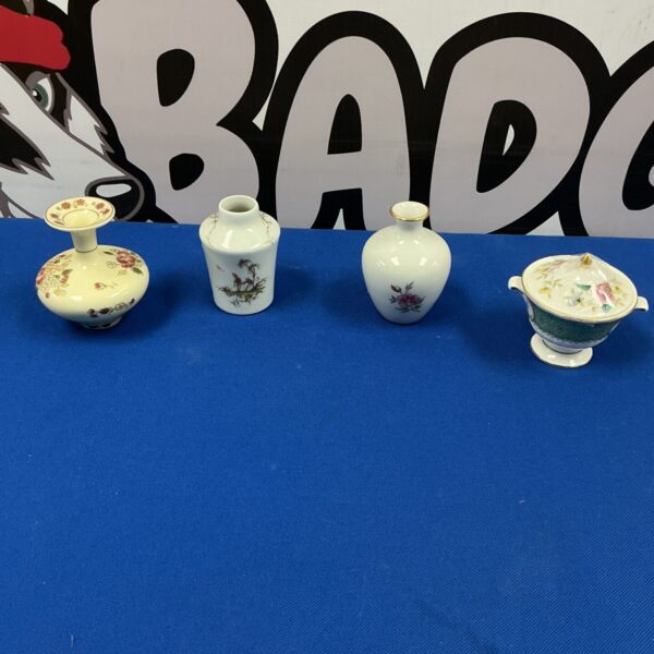 Royal Doulton miniature porcelain vase with floral design.