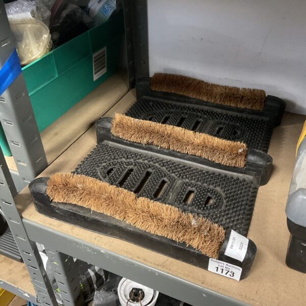 Durable rubber boot cleaning mat for removing dirt and mud.