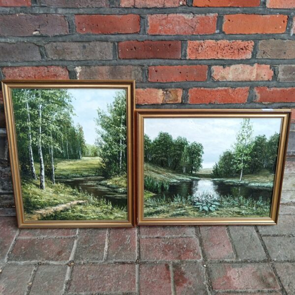 Pair of vintage Russian river landscape paintings with woodland scenes.