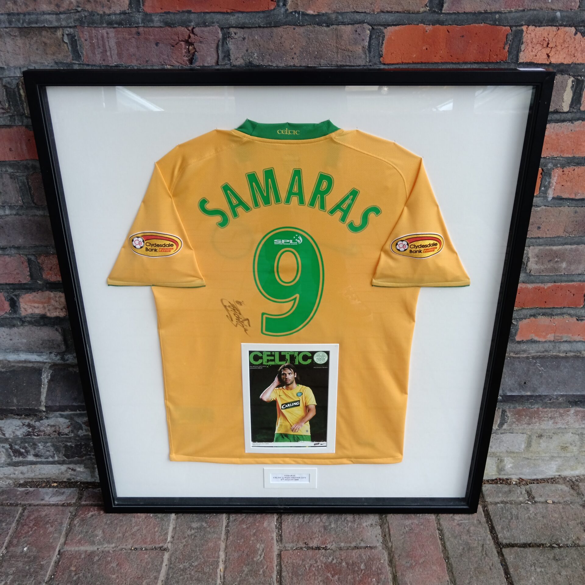 Framed Celtic football shirt signed by Georgios Samaras.