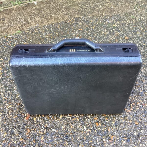 Vintage Samsonite briefcase with number lock, classic travel luggage.