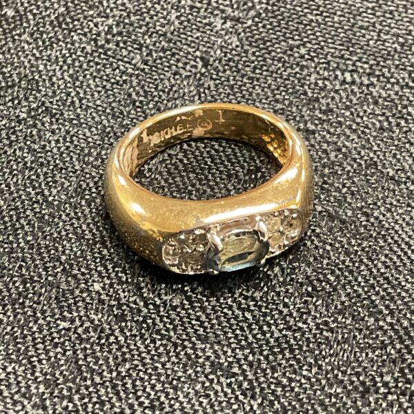 Close-up of a vintage sapphire cocktail ring with gold plating.