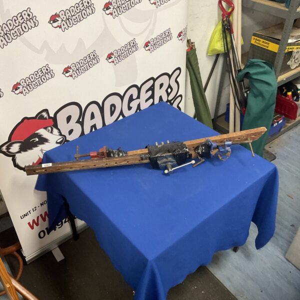 Vintage sash clamps and a Record bench clamp for woodworking.