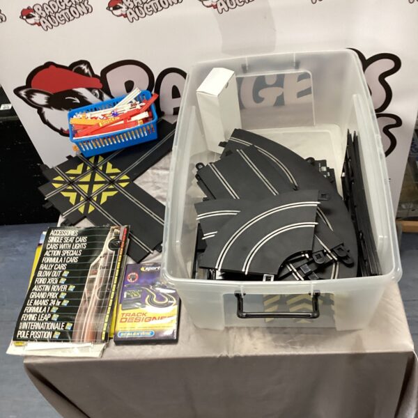 Scalextric track and accessories lot, including a CD-ROM.