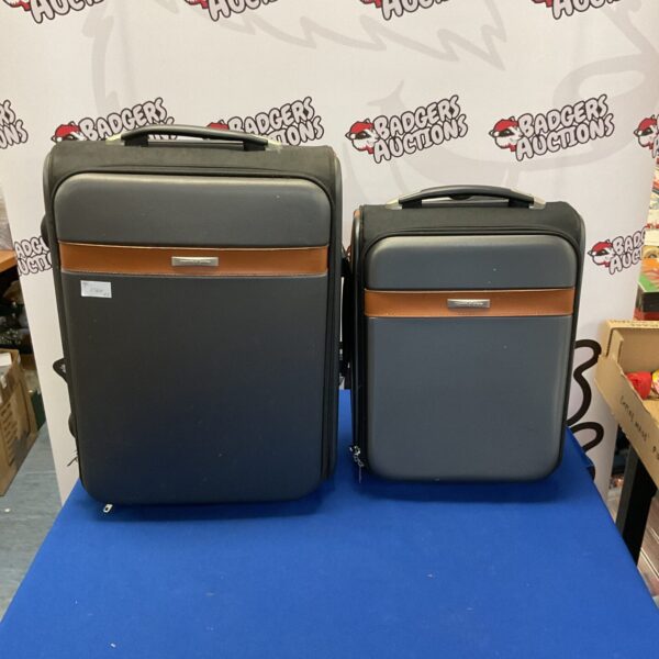 Pair of vintage Scotts of Stow hard shell suitcases.