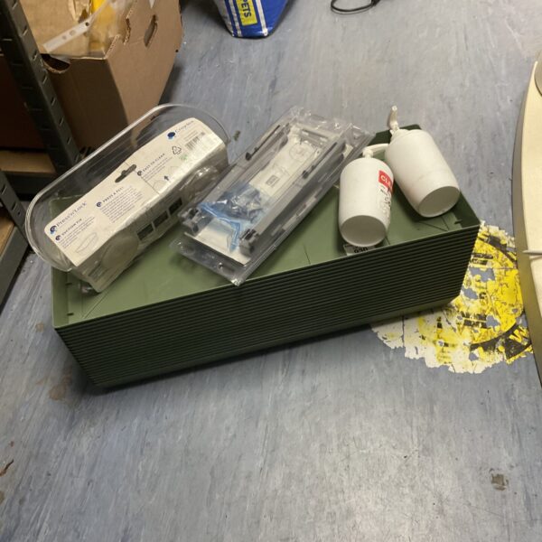 Assorted seedling trays and garden accessories for plant propagation.