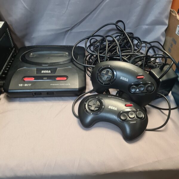 Sega Megadrive II 16-bit console with controllers and leads.
