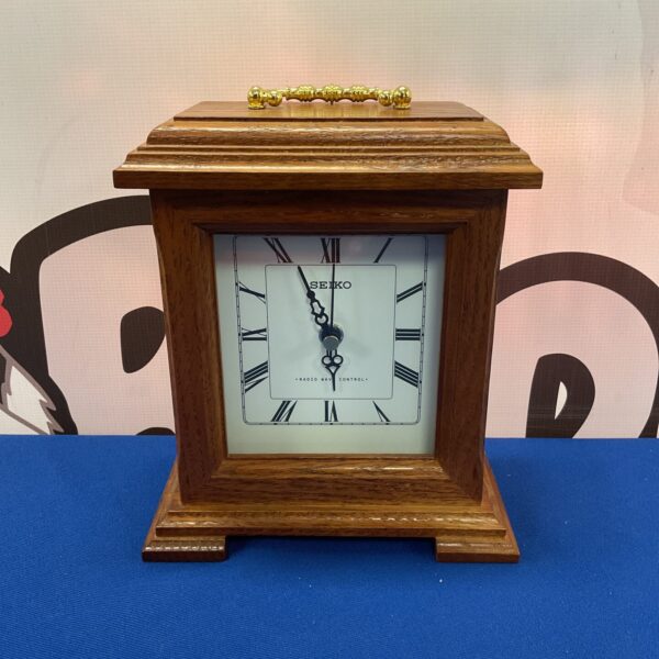 Vintage Seiko radio wave control mantle clock on display.