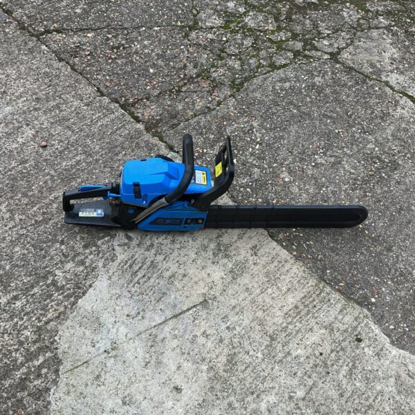 Front view of a used SGS petrol chainsaw for garden work.