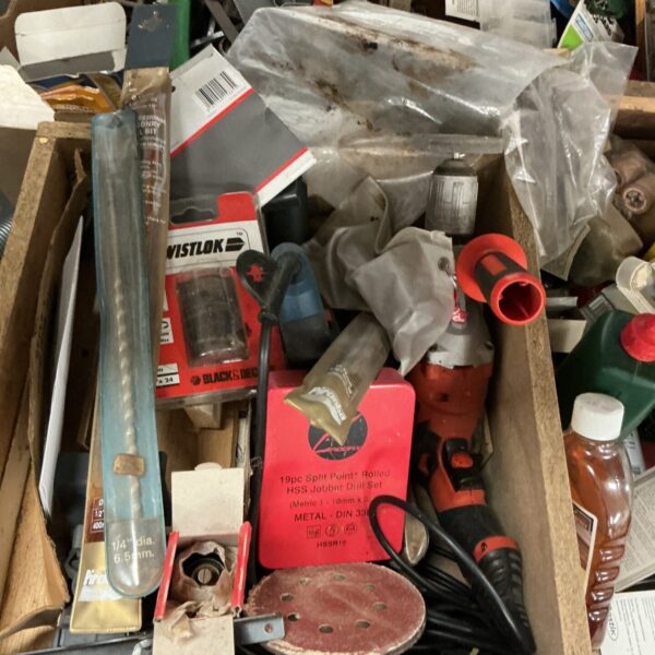 Shed clearance lot with drill and drill bits for DIY projects.