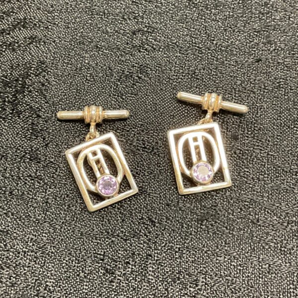 Vintage silver cufflinks with amethyst stones, art deco style.