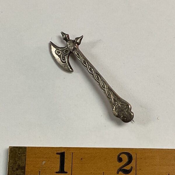 Vintage silver axe brooch with Chester hallmark.