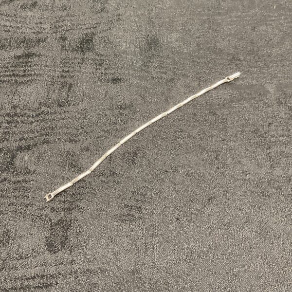 Close-up of a solid silver bar link bracelet.