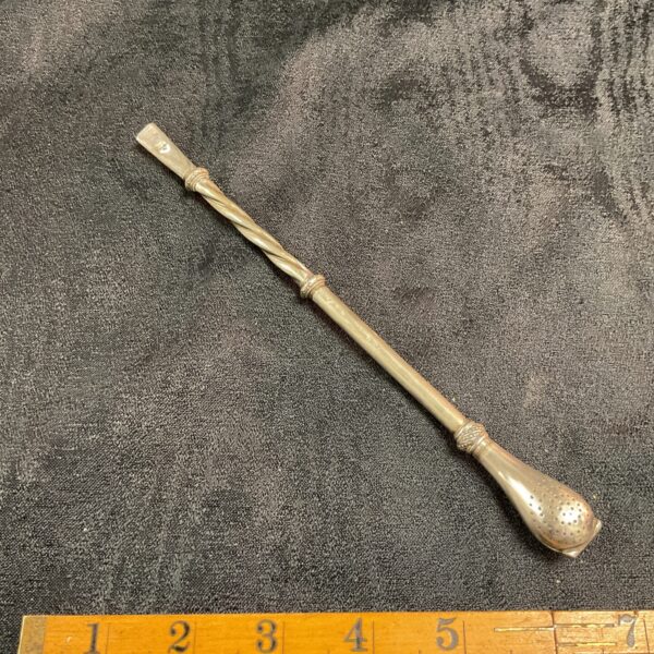 Antique silver bombilla straw for drinking mate.