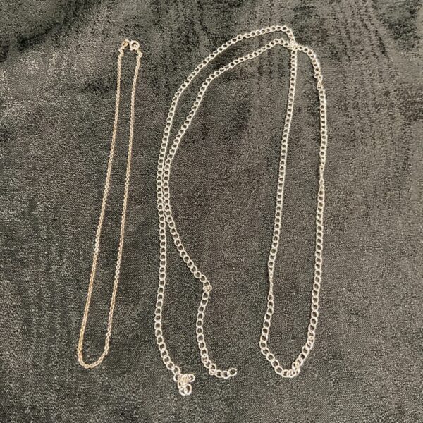 Silver chain lot featuring 40 and 16 inch lengths.