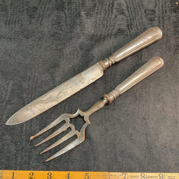 Vintage silver plate cake knife and fork set with silver handle.