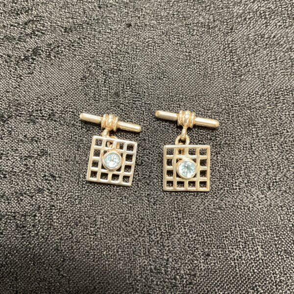 Vintage silver cufflinks with a square topaz gemstone.