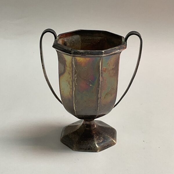 Antique silver trophy cup with two handles, hallmarked silver.