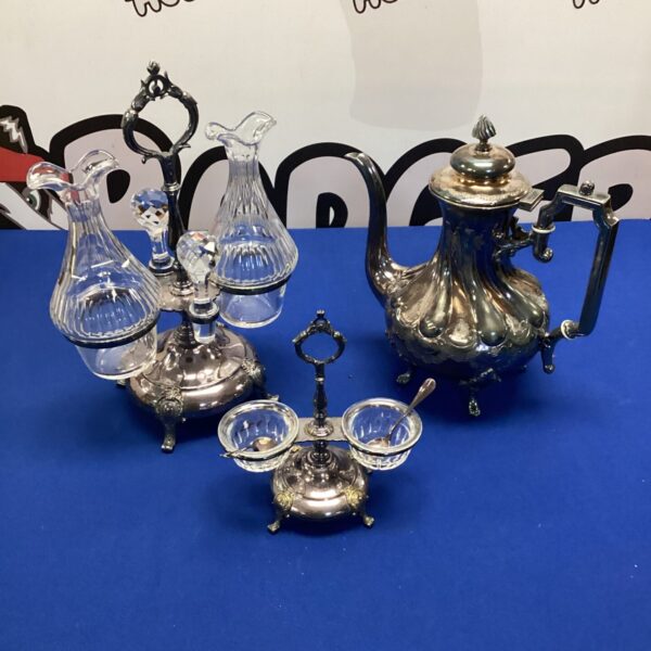 Vintage silverplate tea set displayed on a tray.