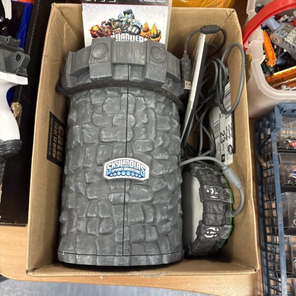 Skylanders Adventure Tower with PS3 game and portal accessory.