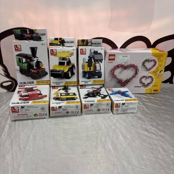 Sealed Sluban and Lego brick sets in a toy lot.